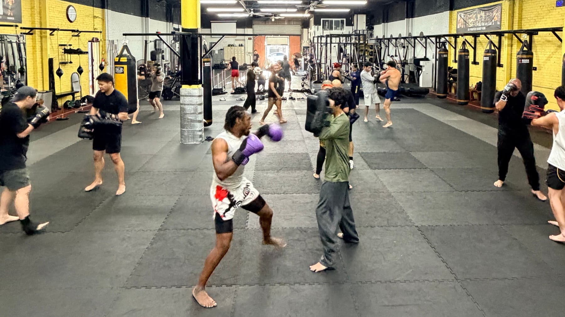 Members training together on the gym floor at TAEJO Kickboxing in Los Angeles